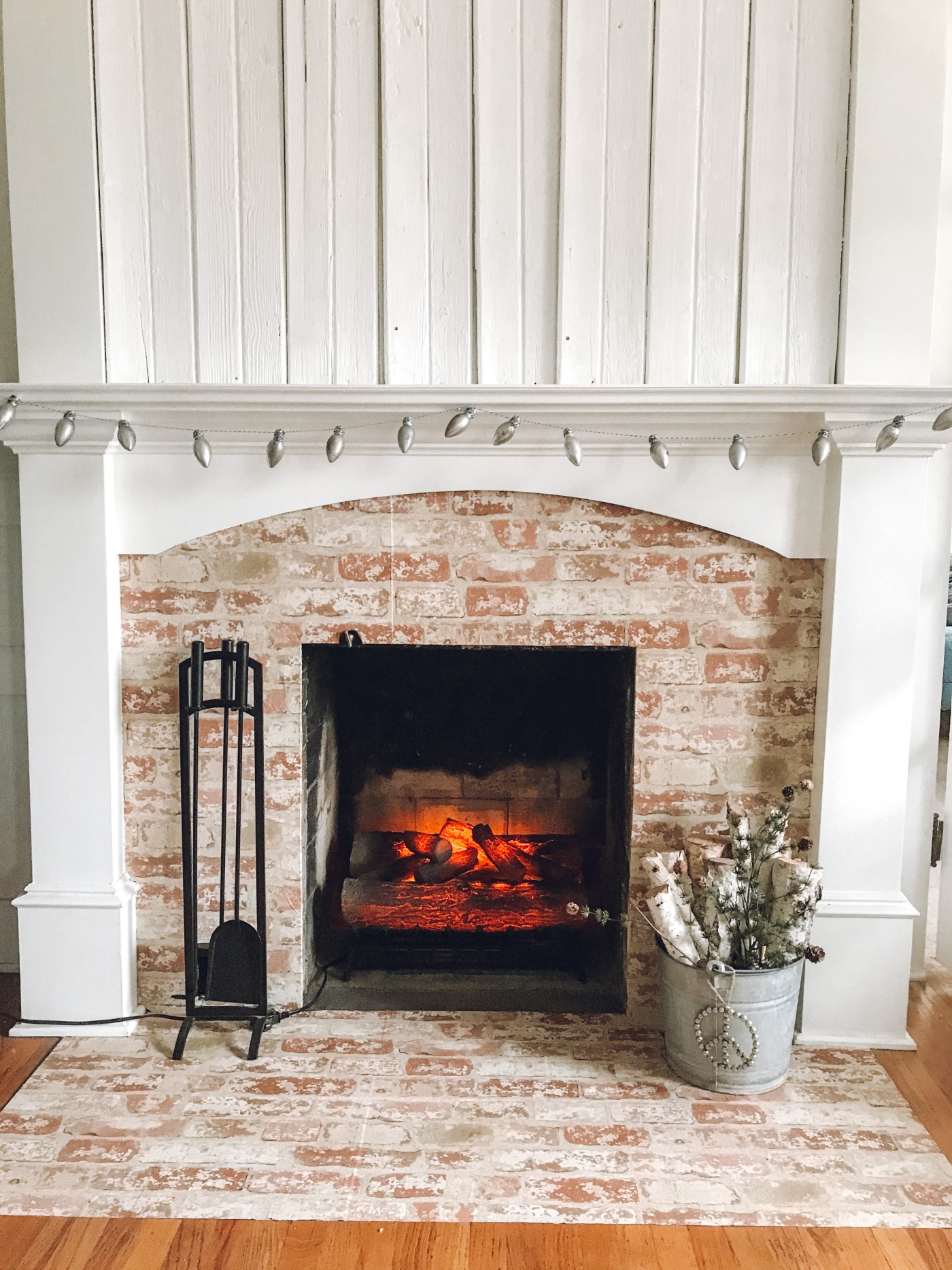 living room with brick fireplace