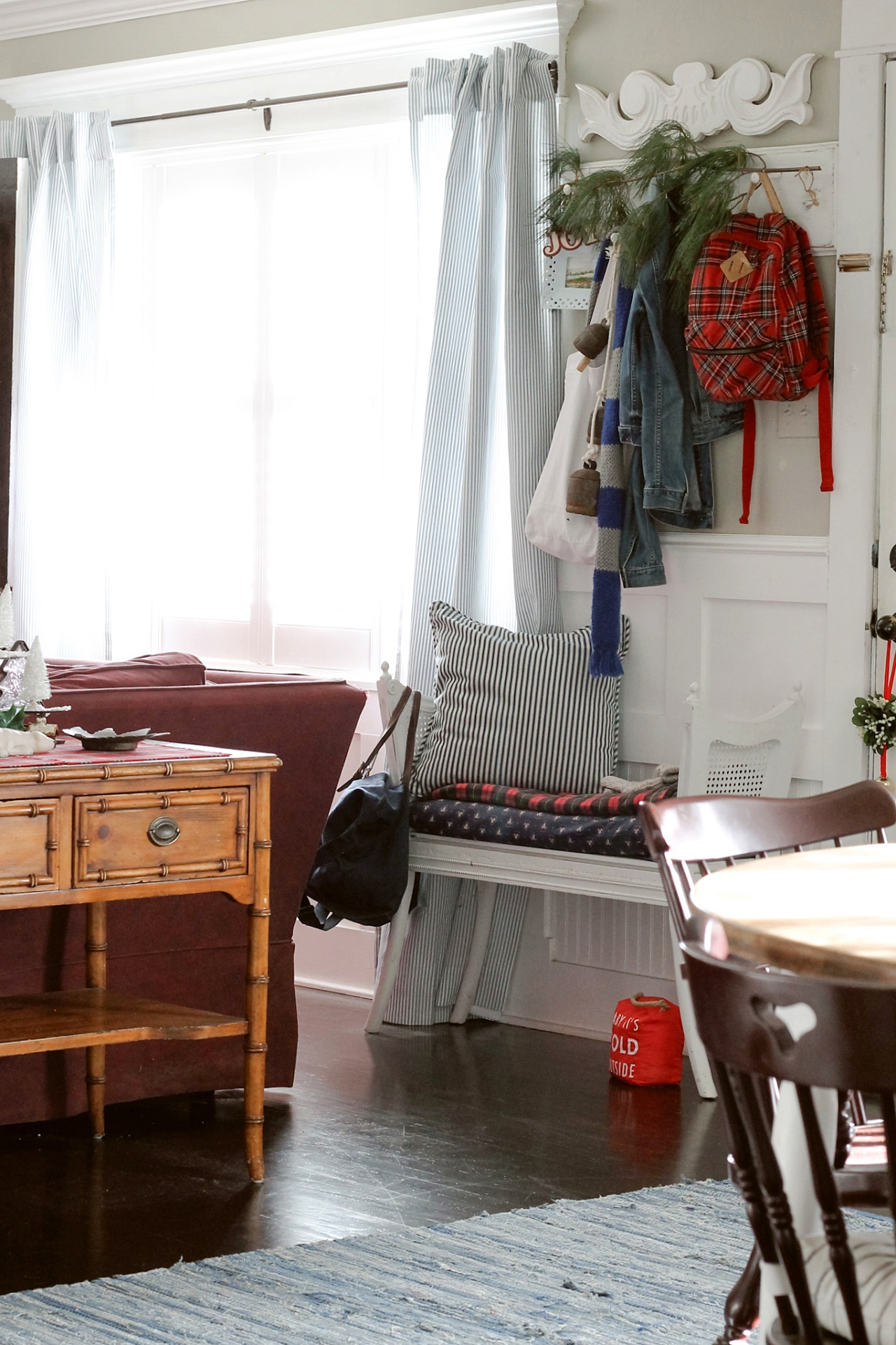 Christmas Entryway with red tartan and a real pine branch