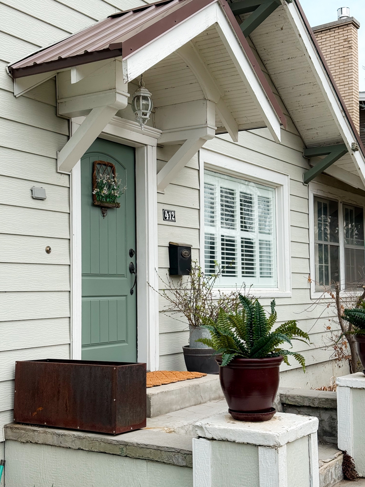 Simple Spring Porch Refresh – With New Faux Ferns