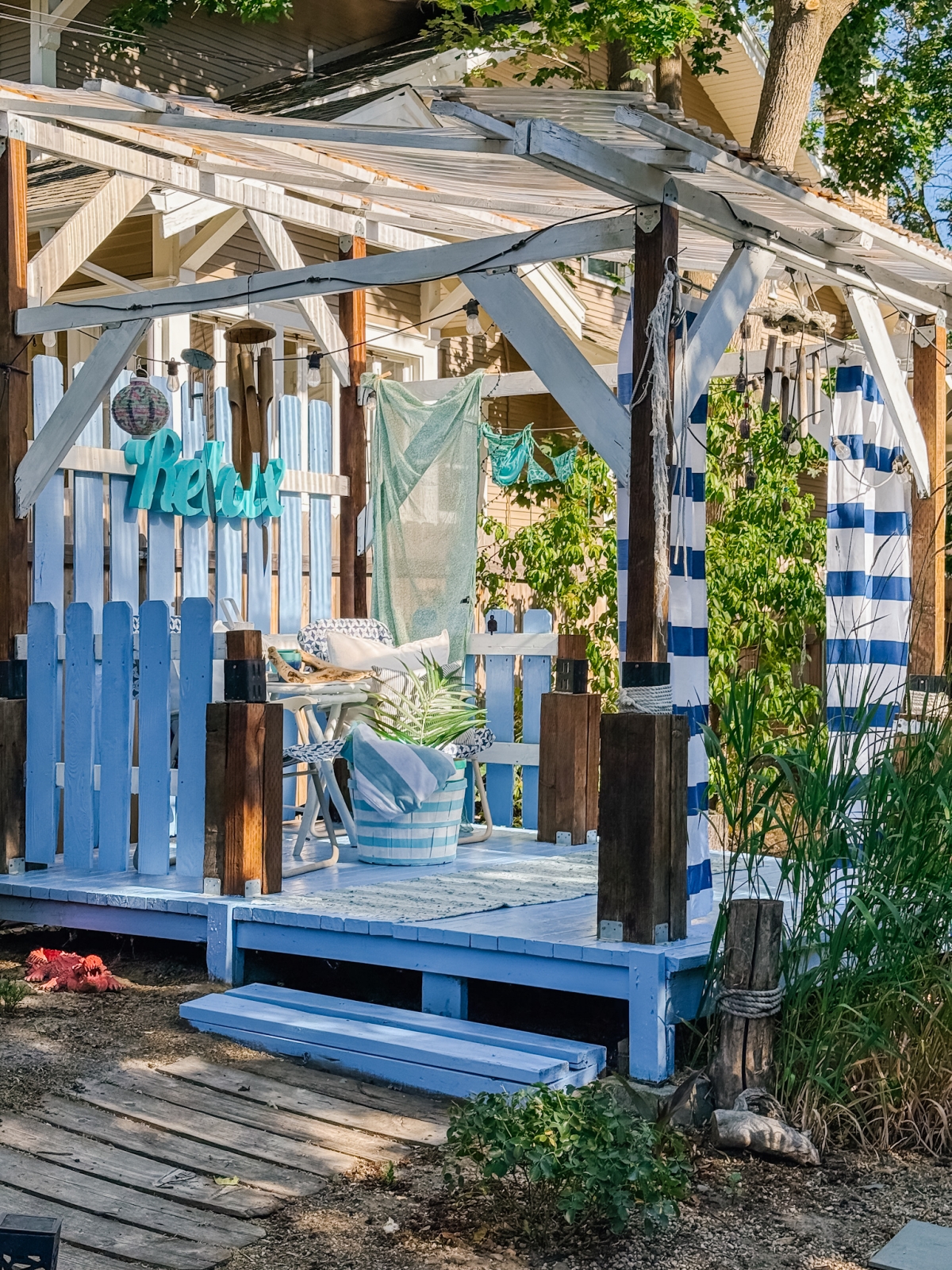 Backyard Cabana Refresh: Blue Paint, Coastal Decor & Outdoor Curtain Ideas